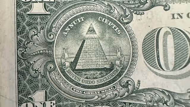 Historical Great Seal illustration featuring the all seeing eye floating over an unfinished stone pyramid